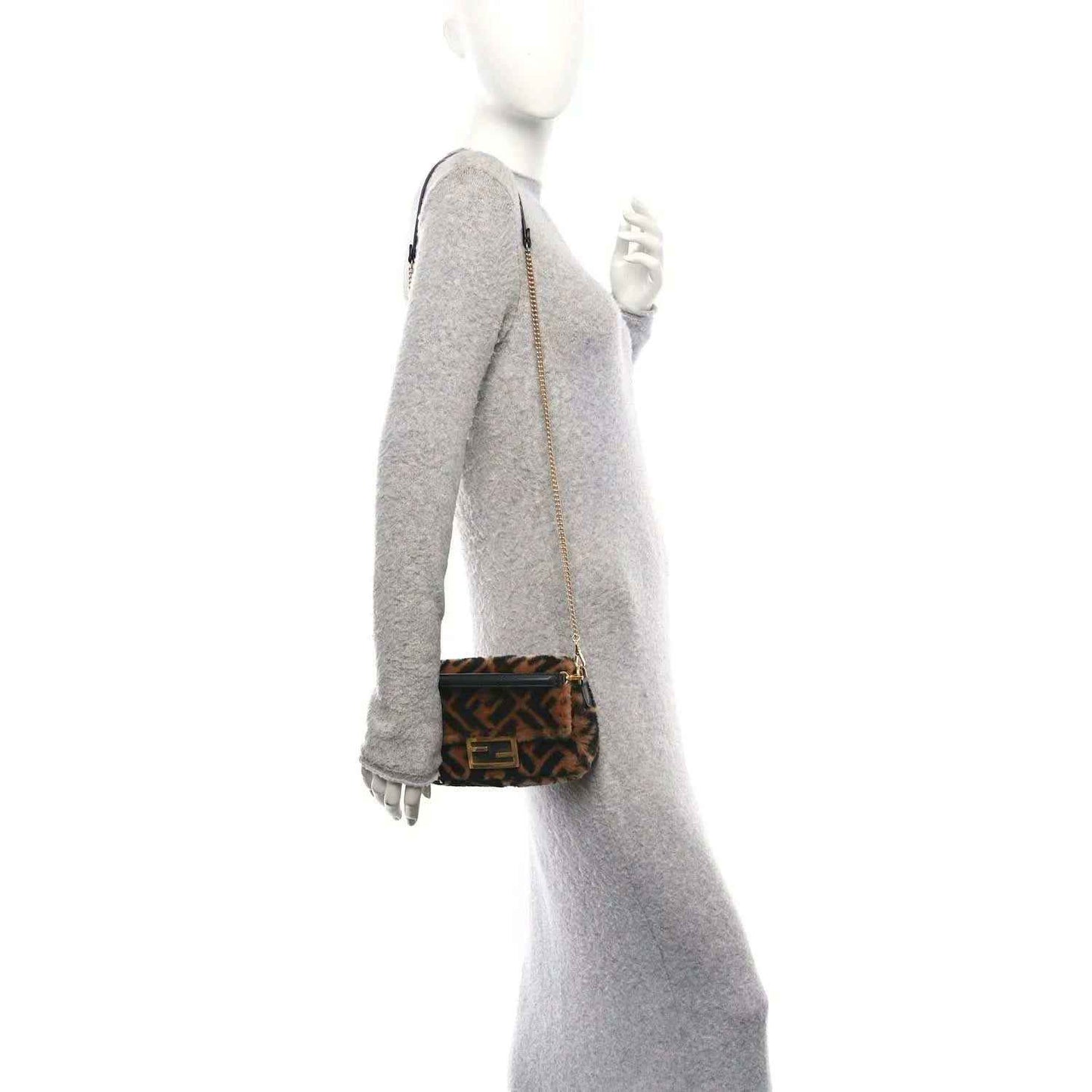 Mini baguette bag with FF logo shearling and black strap, shown in side view.