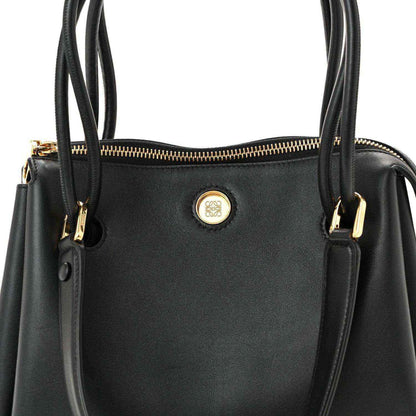 Loewe Small Madrid bag front in black leather with round logo emblem and gold zip.