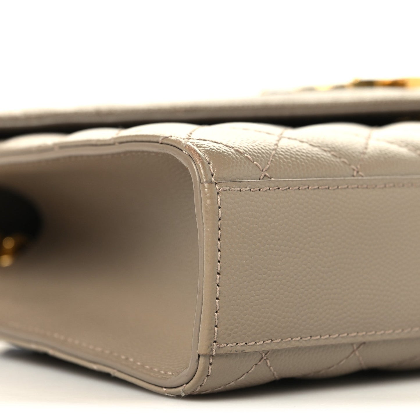 Dusty grey quilted satchel side with seam stitching and gold chain