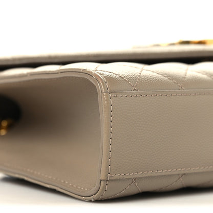 Dusty grey quilted satchel side with seam stitching and gold chain