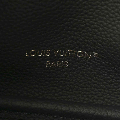 Black leather interior panel with embossed Louis Vuitton Paris text and textured grain