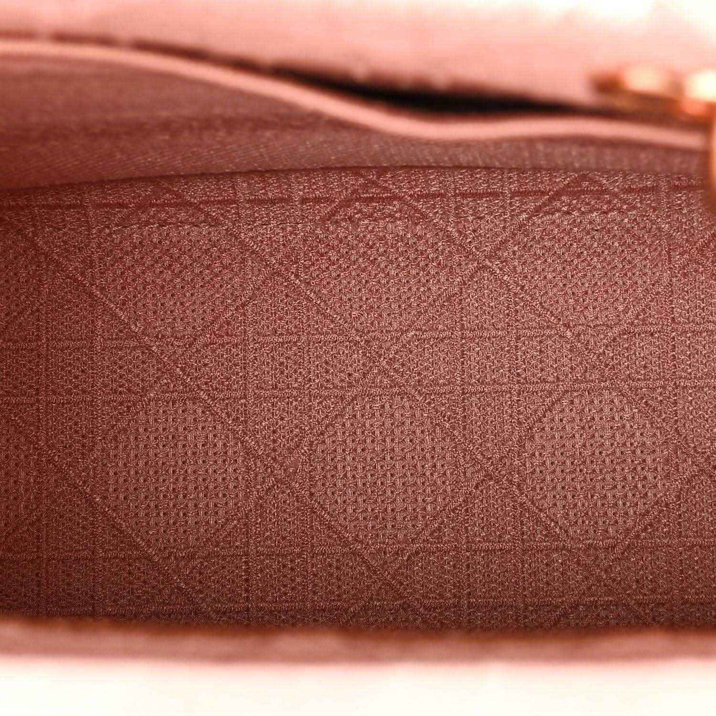 Pink embroidered canvas with geometric lattice pattern texture