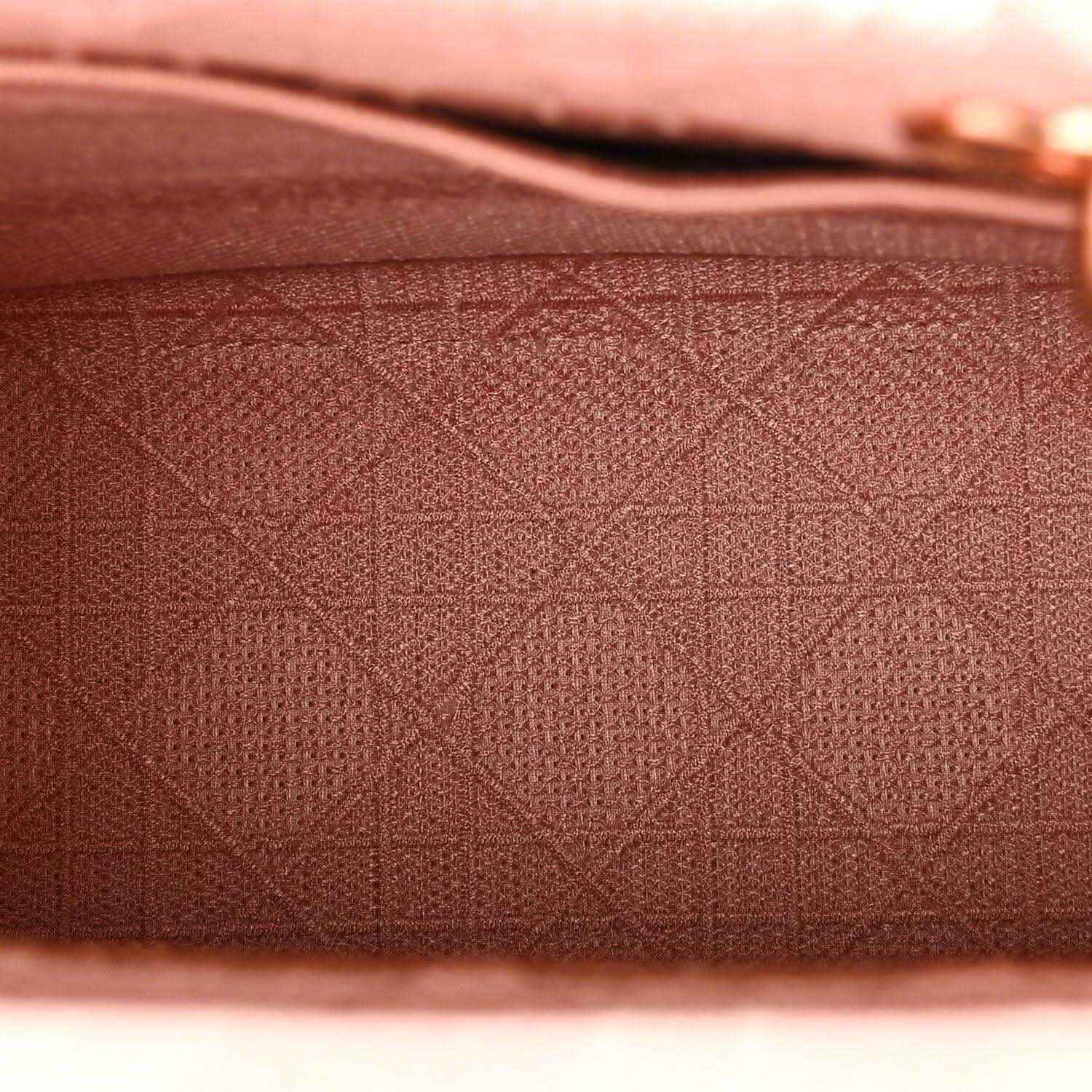 Pink embroidered canvas with geometric lattice pattern texture