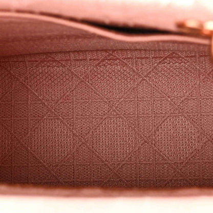 Pink embroidered canvas with geometric lattice pattern texture
