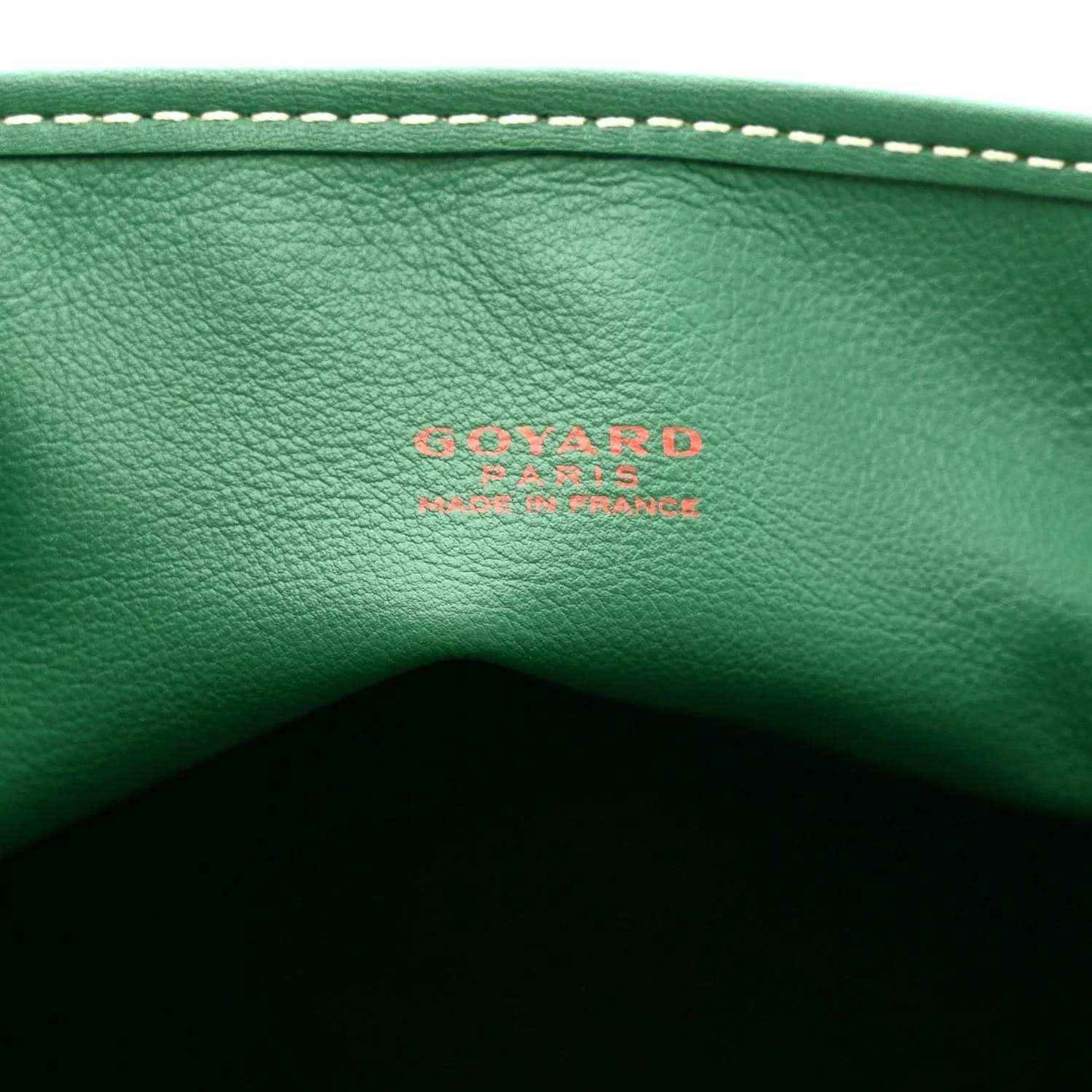 Green leather tote bag panel with embossed Goyardine logo and contrast stitching