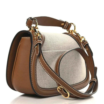 Medium top-handle bag with crossbody strap, beige textured canvas and brown leather trim