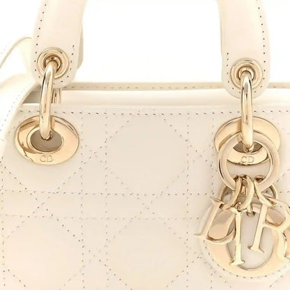 Cream micro lady D-Joy bag front with gold CD and 'D' charm hardware