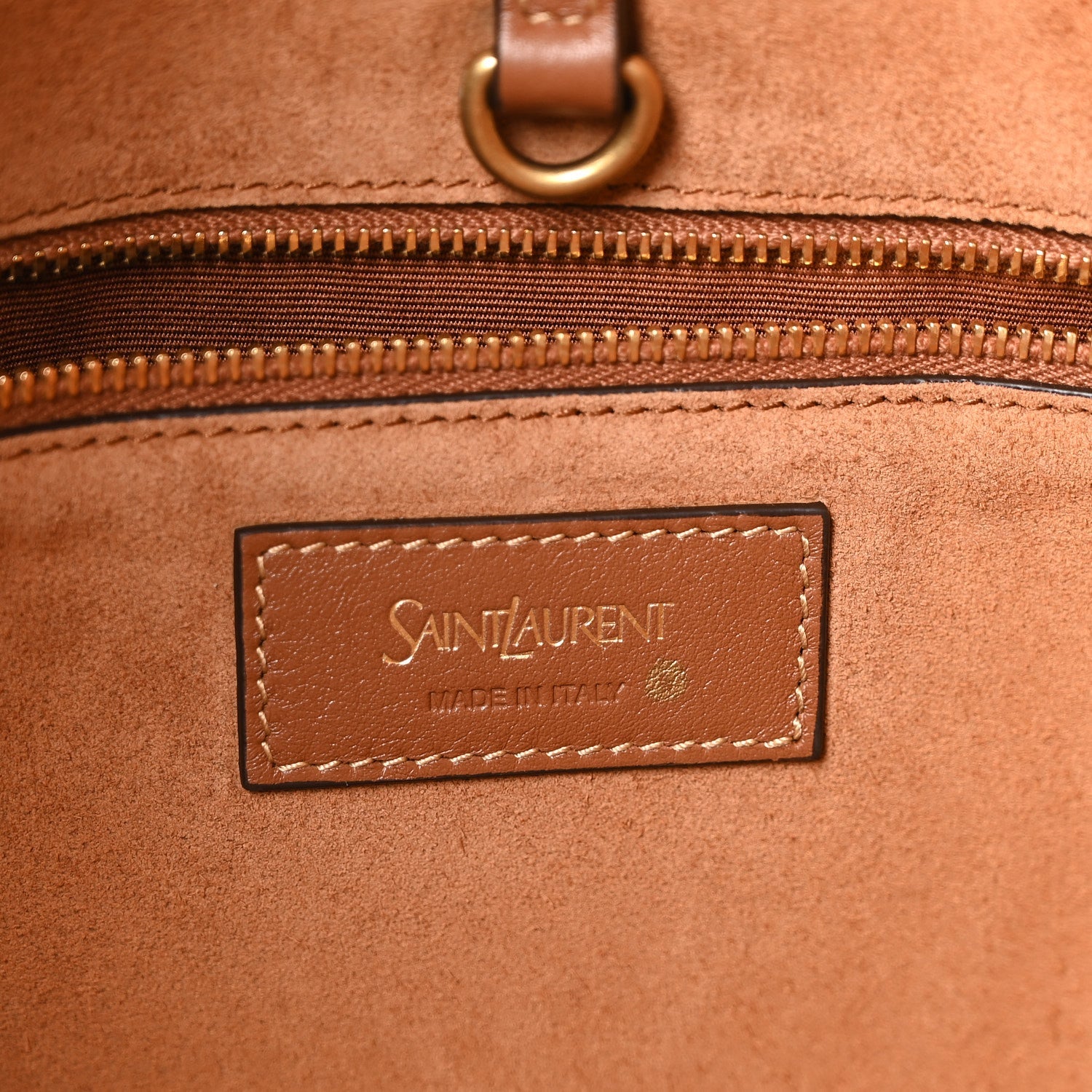 Tan-brown leather tote logo patch reading "SAINT LAURENT" and "MADE IN ITALY"