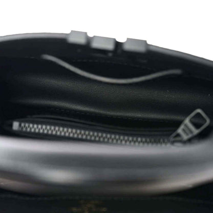 Black leather mini handbag interior with zipper and trim edge