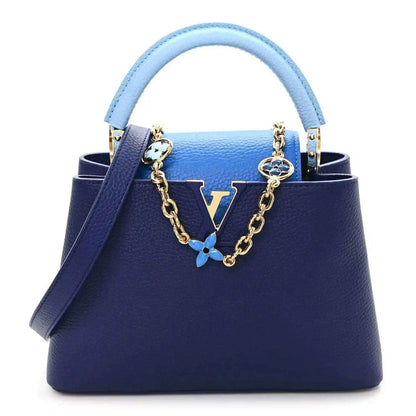 Blue Louis Vuitton Capucines BB handbag with chain strap and enamel flower charm