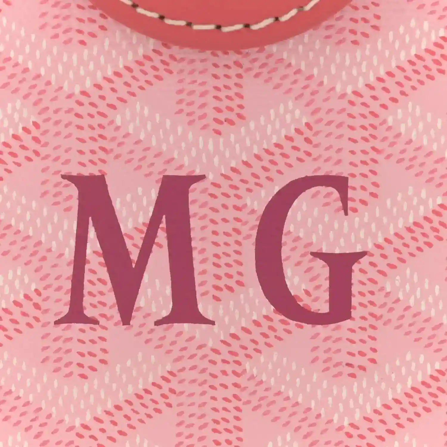 Pink canvas bag with large MG lettering