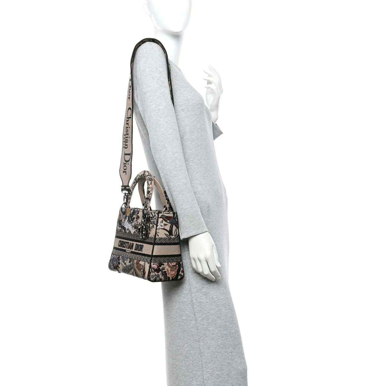 Floral embroidered canvas tote with shoulder strap, styled on a mannequin.