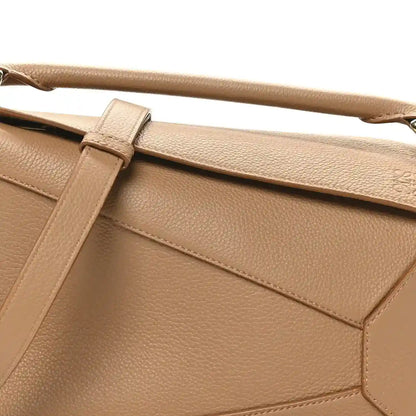 Loewe small Puzzle Edge bag top flap with grained texture and strap tab