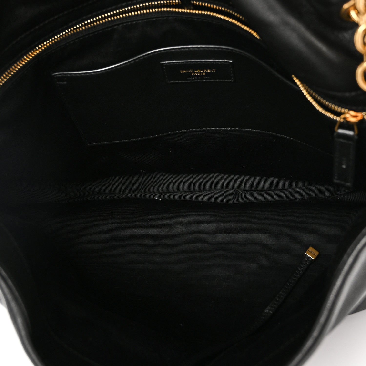 Black lambskin bag interior with gold zipper trim and inner pocket