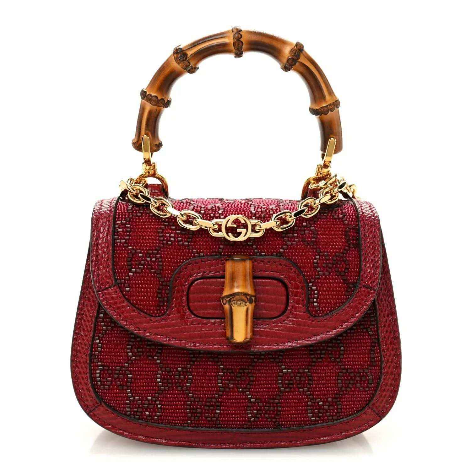 Red mini top-handle bag with bamboo-look handles, gold chain strap, logo front hardware.
