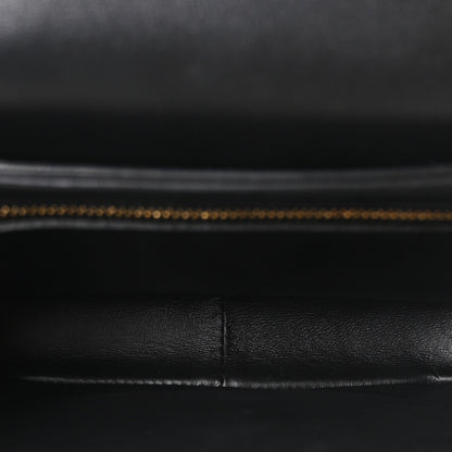 Black leather interior lining with visible stitched seam