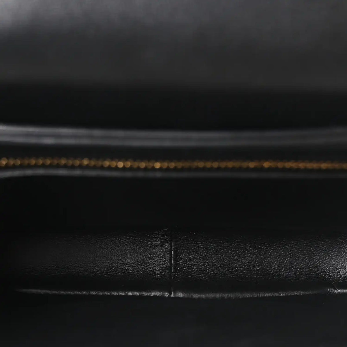 Black leather interior lining with visible stitched seam