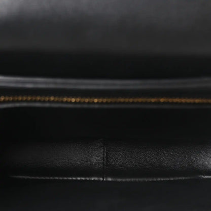 Black leather interior lining with visible stitched seam