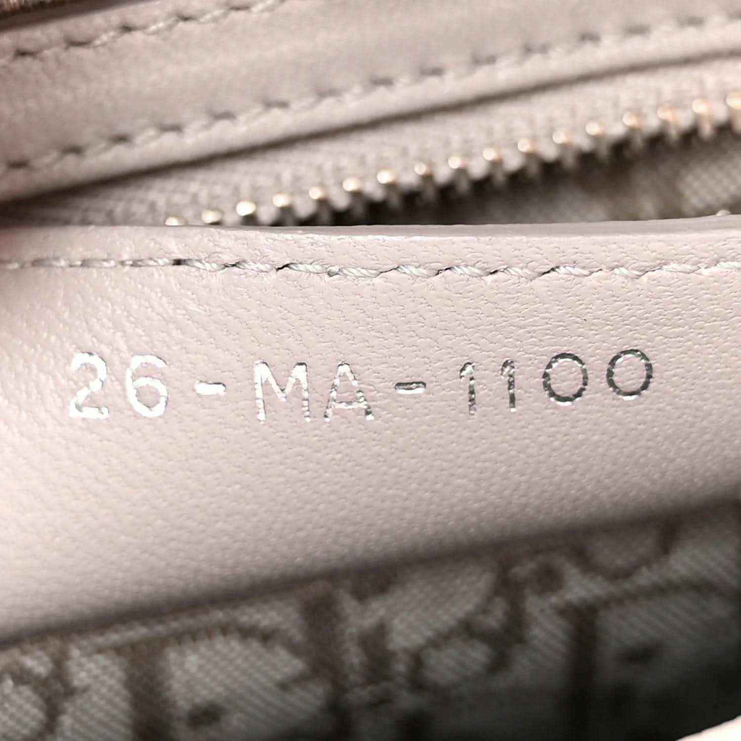 Model code stamping on grey leather lining of Lady Dior handbag
