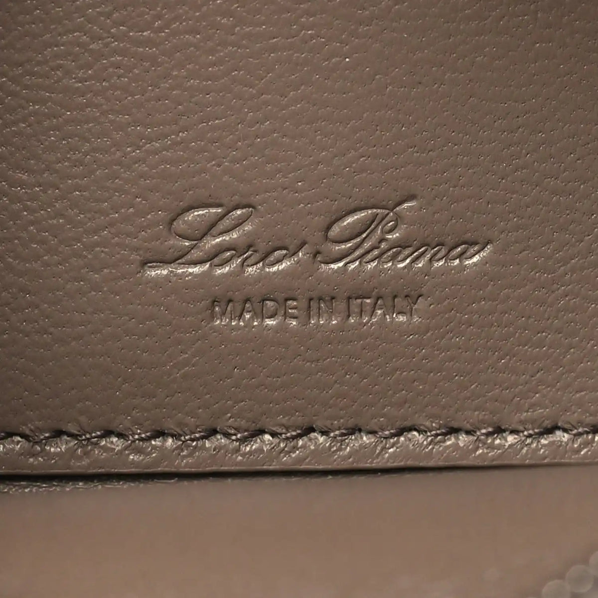 Embossed Loro Piana logo on grained leather with “MADE IN ITALY”