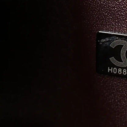 Flap bag interior label holder with printed marking on dark lining