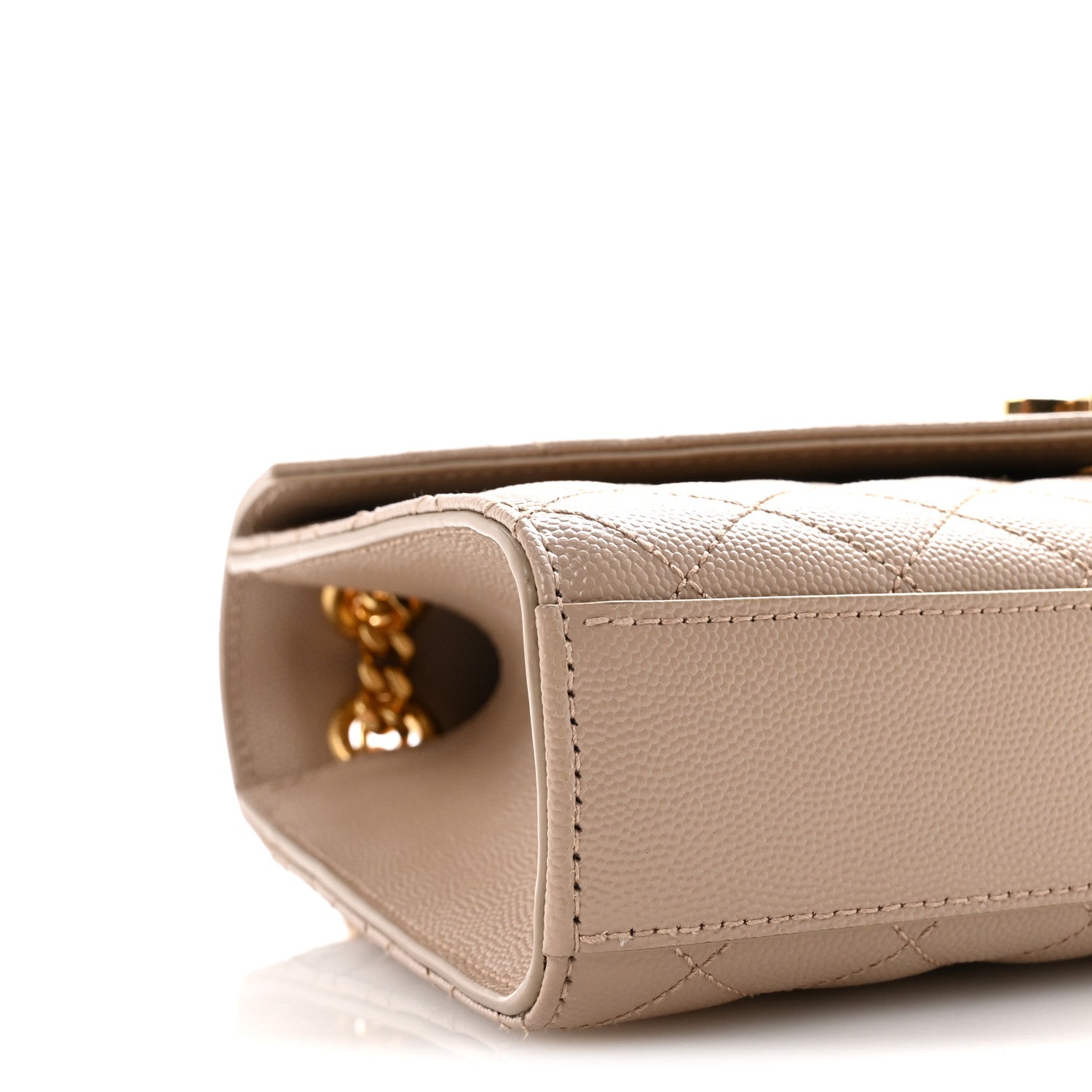 Satchel bag corner close-up with gold-tone chain detail and stitched leather trim in dark beige.