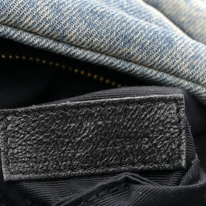 Denim satchel interior pocket with black leather patch label