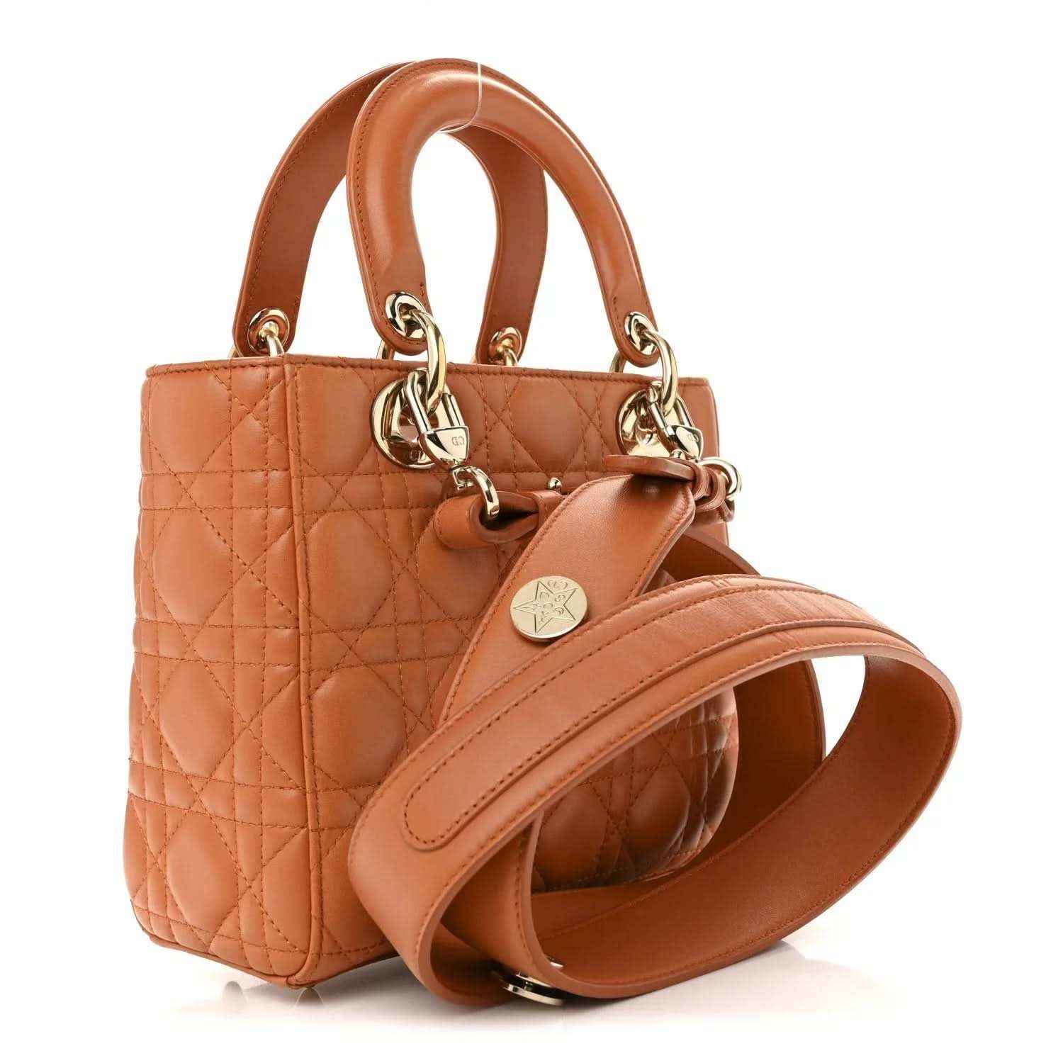 Small Lady Dior tote in orange quilted lambskin with top handles and gold chain drop