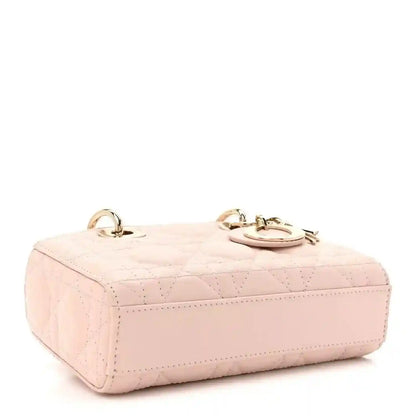 Pink quilted leather mini handbag with two top rings and gold-tone hardware