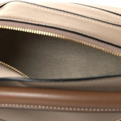 Small Puzzle bag interior lining with gold-toned zipper track