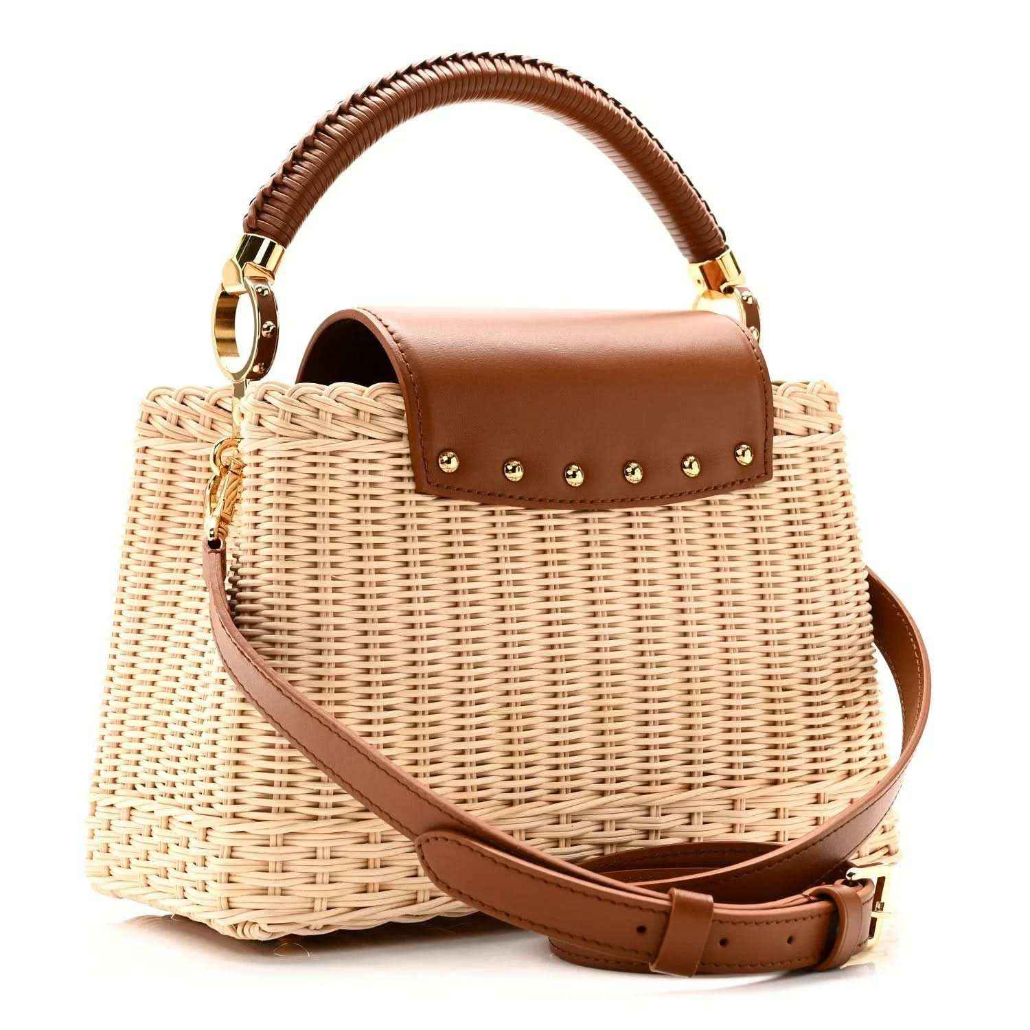 Tan rattan handbag with brown leather flap top, gold studs, and crossbody strap