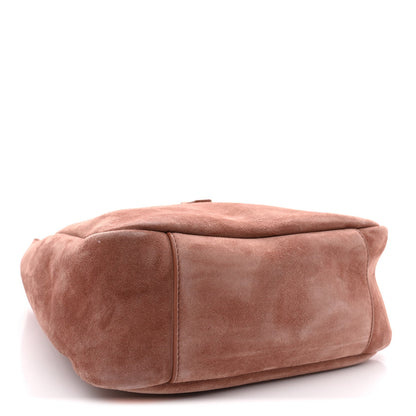 Small suede hobo bag in barley pink with rounded profile and stitched seams