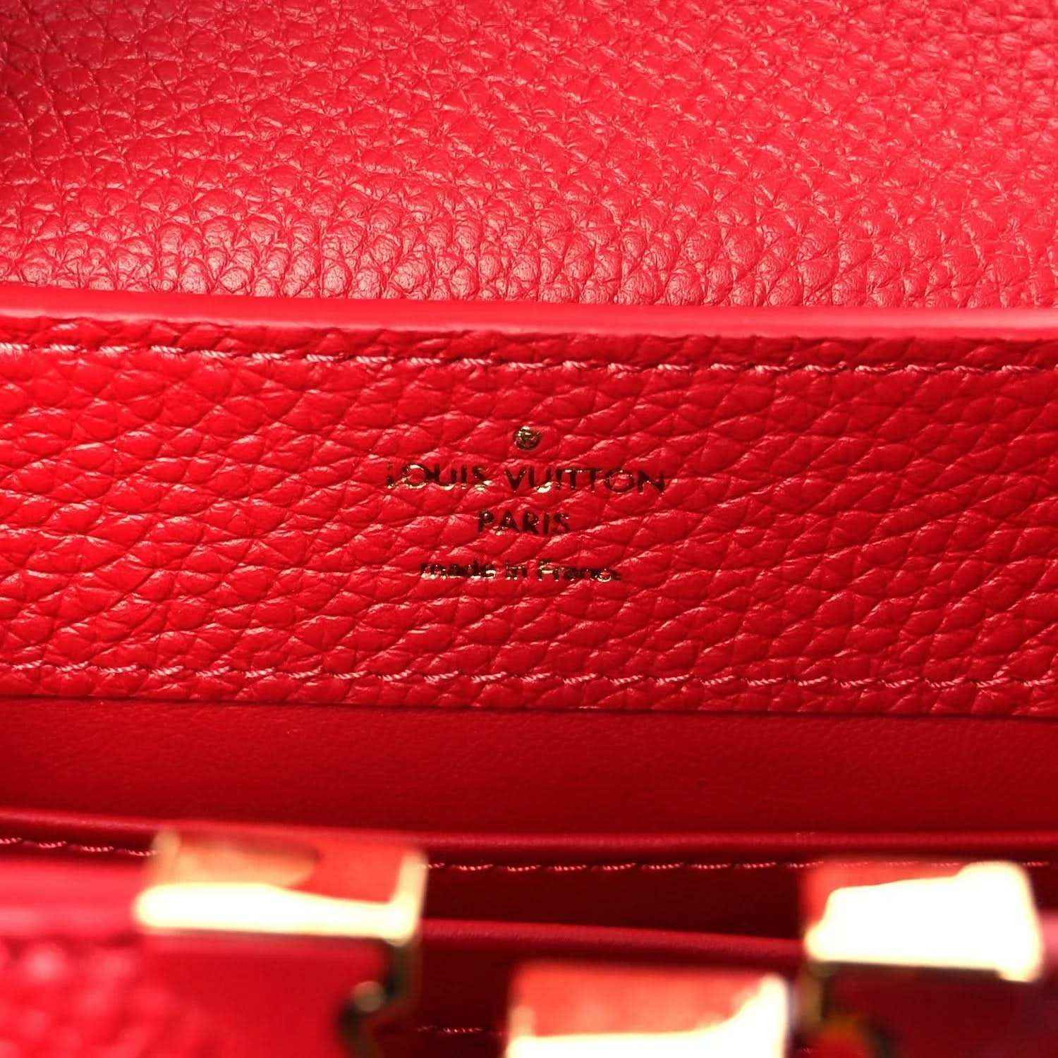 Louis Vuitton scarlet leather mini handbag with embossed logo on inner panel