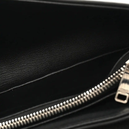 Black leather bag interior with silver zipper and metal zipper pull