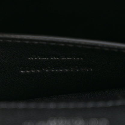 Black leather satchel interior seam and edge stitching close-up