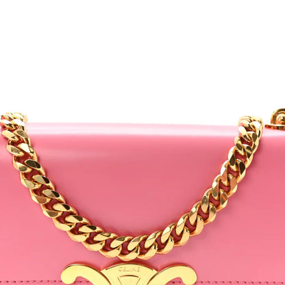 Flamingo pink leather bag front with gold Triomphe emblem and chain