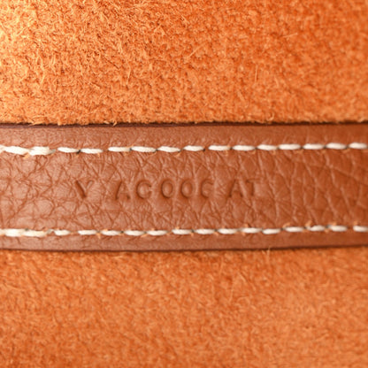 Brown leather edge with contrast stitching and sewn seam detail
