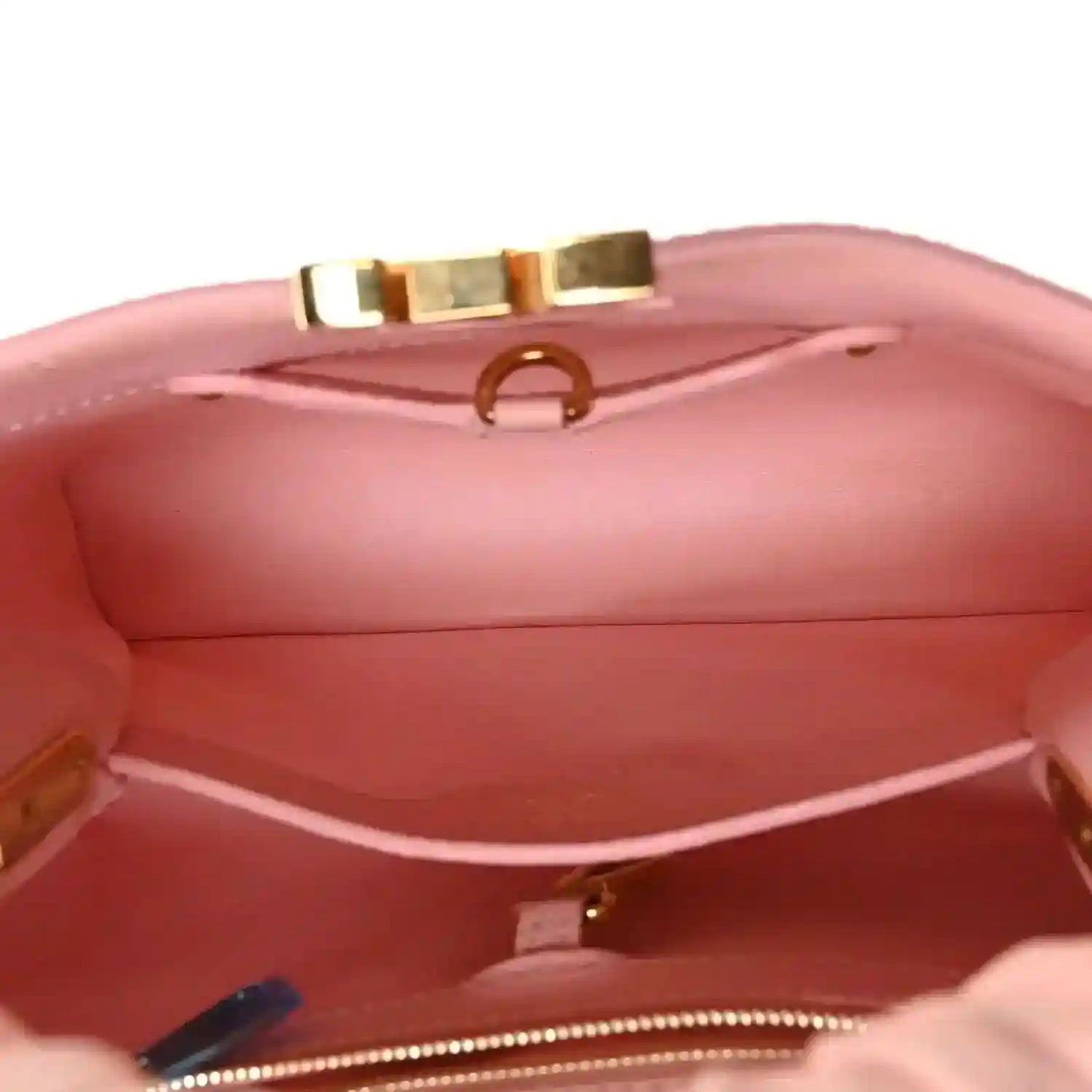 Bubble gum pink leather Capucines BB bag interior with stitched lining and zipper trim