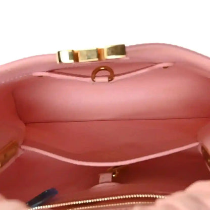 Bubble gum pink leather Capucines BB bag interior with stitched lining and zipper trim