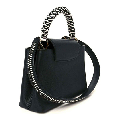 Black leather handbag with top flap, braided chain strap and studded edge