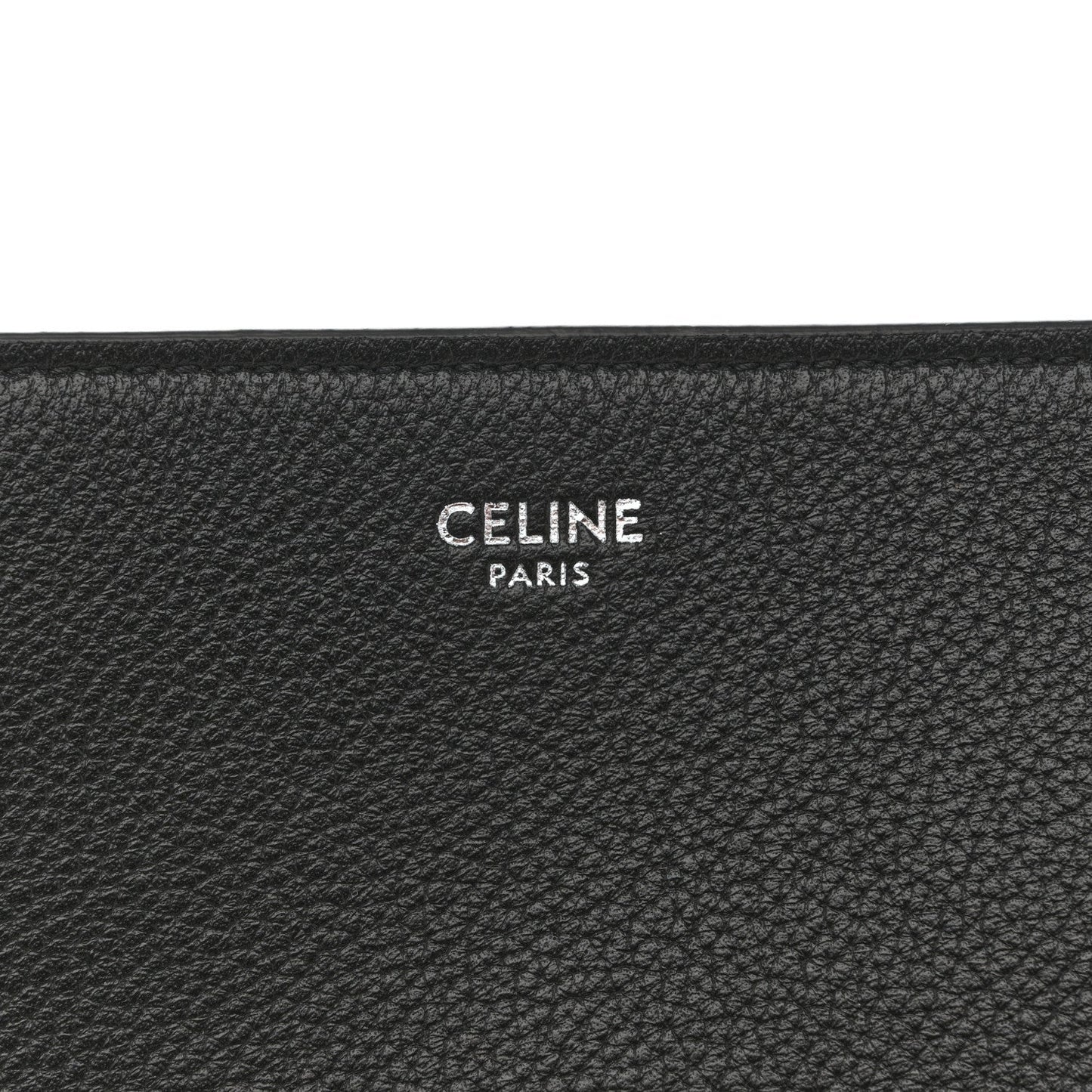 Black leather bag interior panel with CELINE PARIS embossed logo