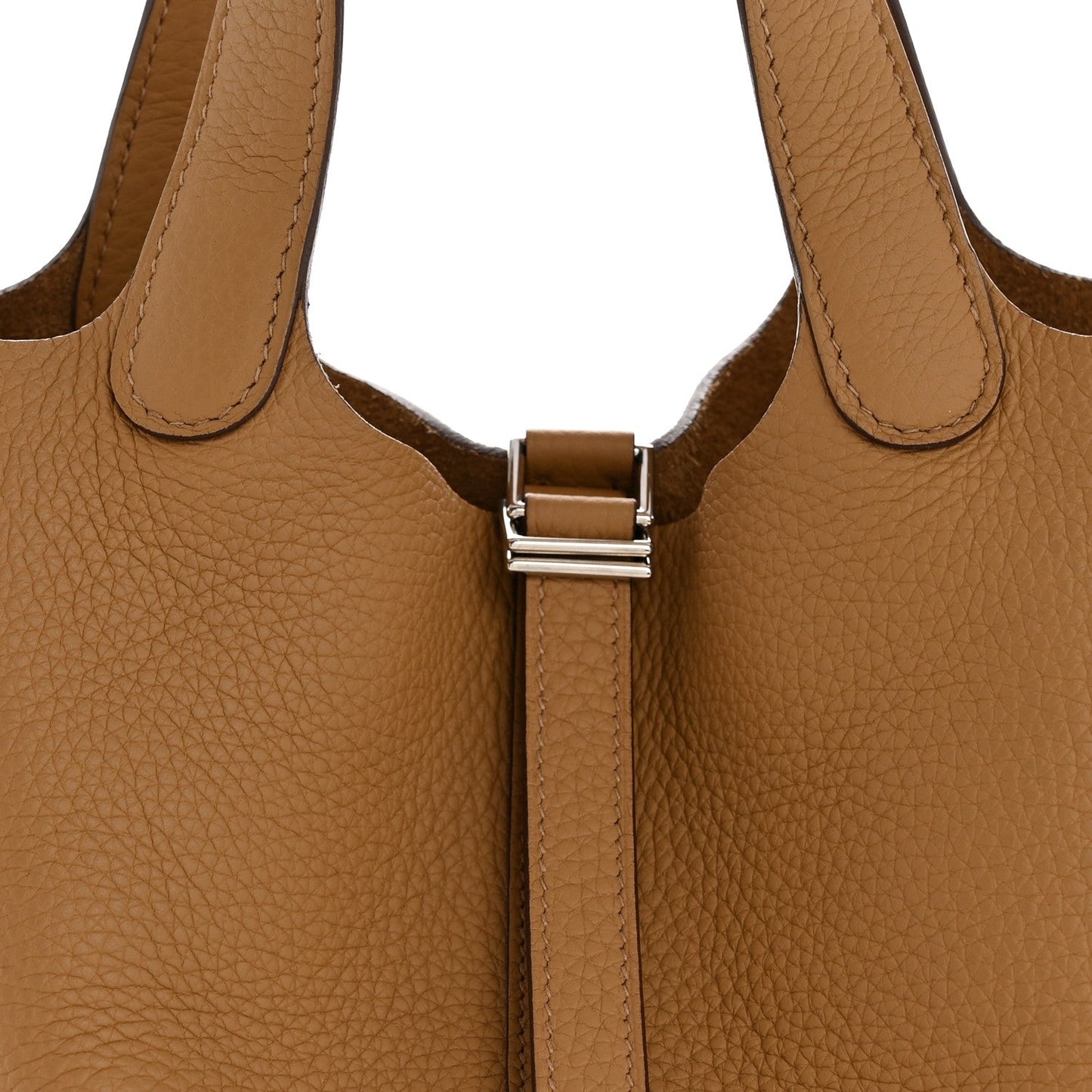 Tan leather bucket bag with silver-tone strap clasp and handles