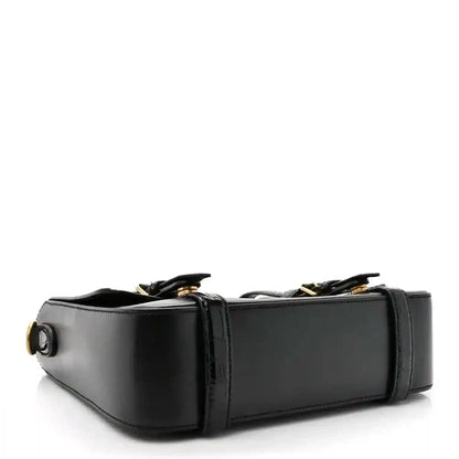 Black leather medium messenger bag with side profile and circular strap detail
