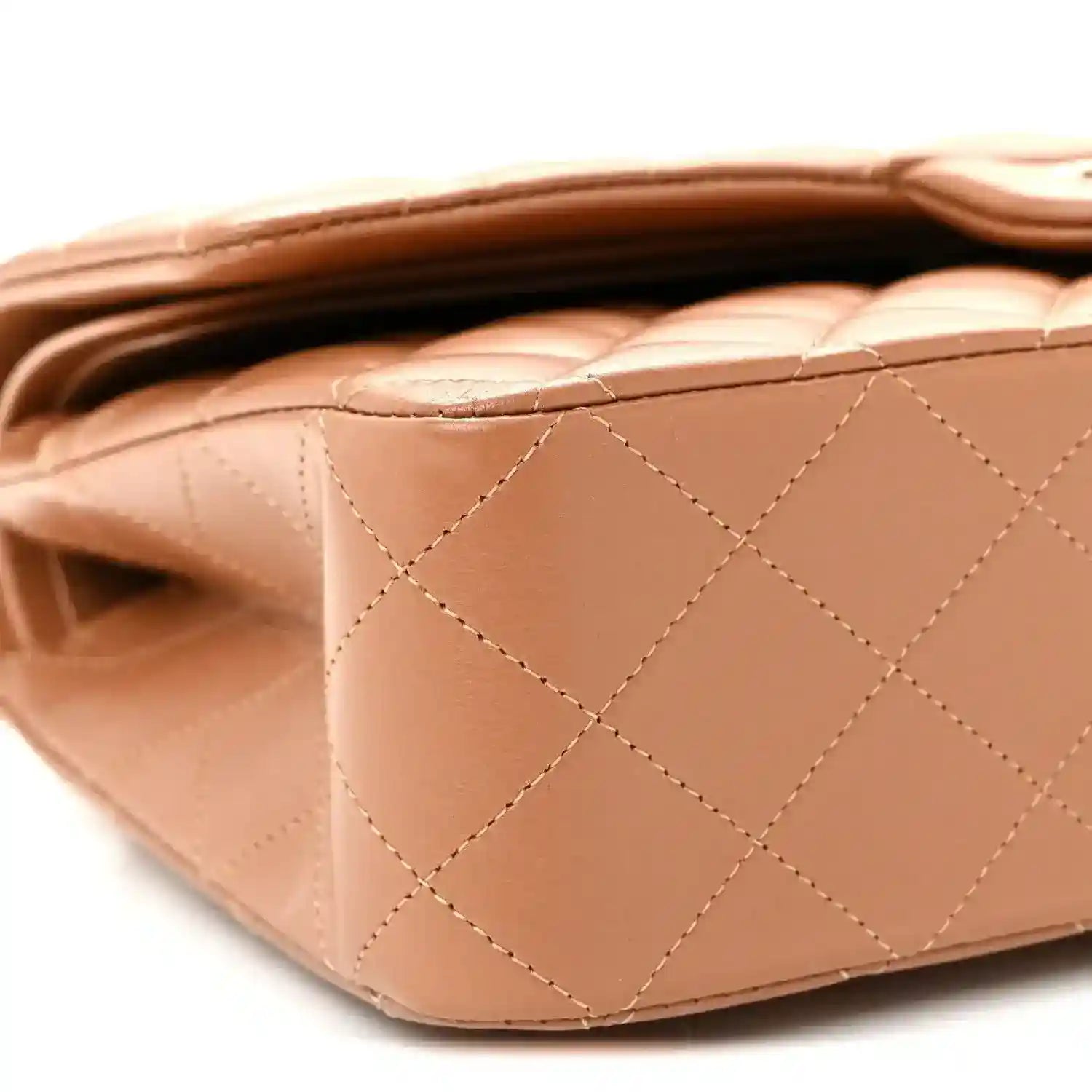 Chanel medium quilted lambskin bag side with quilted pattern and tan-brown edge trim