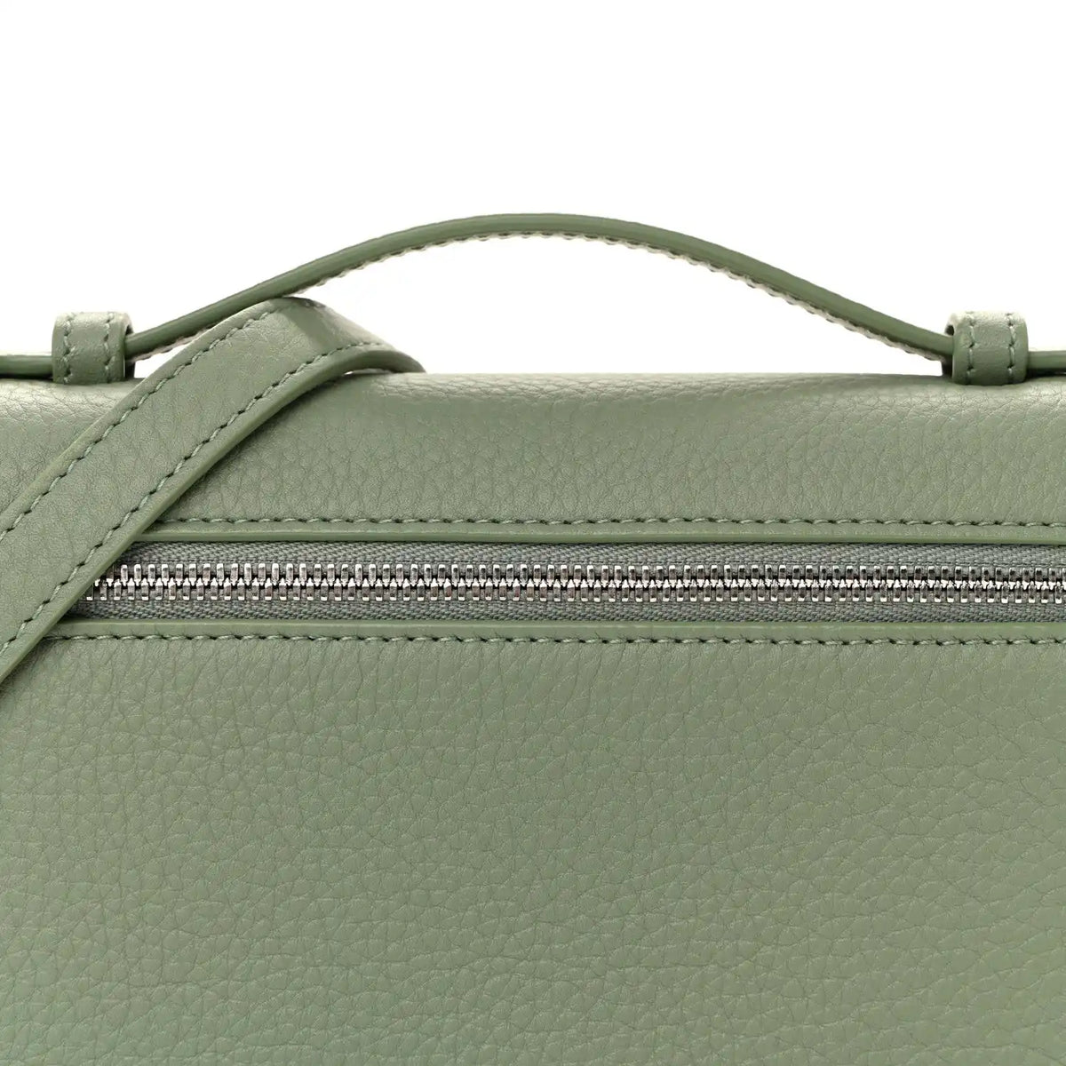 Sage green leather pouch front with top zipper and strap attachment