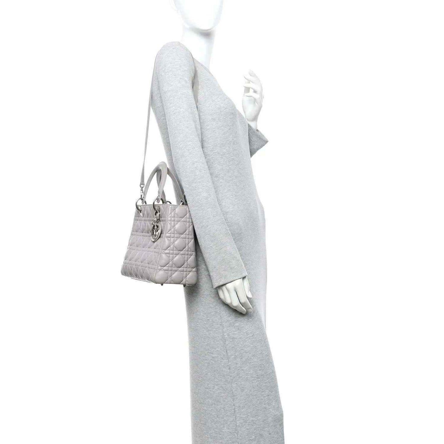Grey Lady Dior medium handbag worn crossbody with thin shoulder strap and top handles