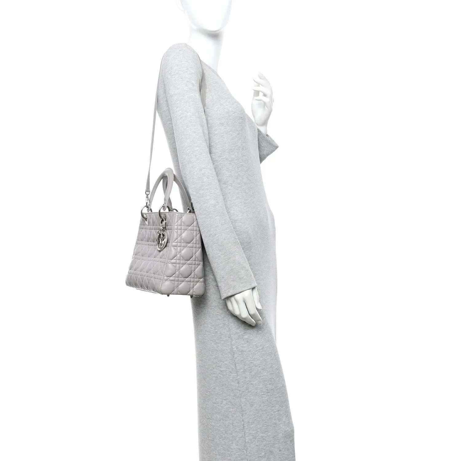 Grey Lady Dior medium handbag worn crossbody with thin shoulder strap and top handles