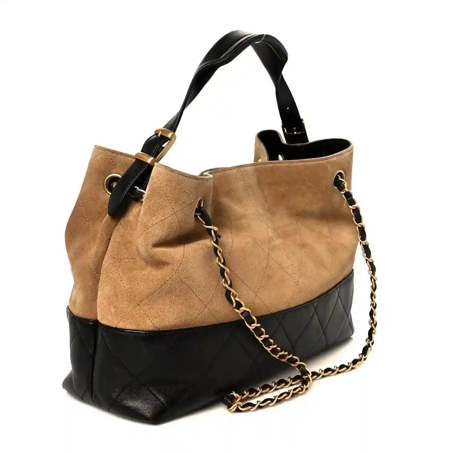 Beige suede small shopping bag with black quilted bottom, top handles, and chain strap
