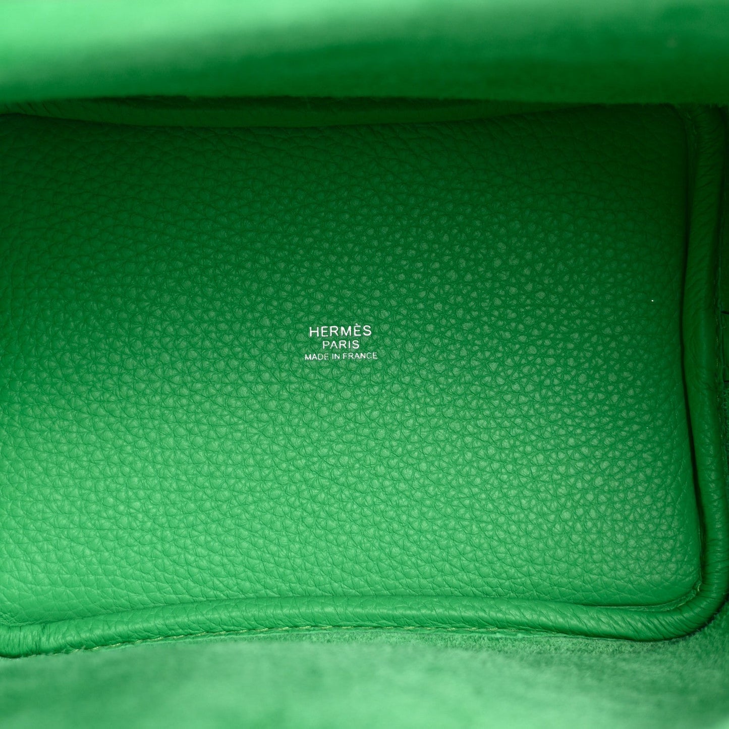 Green leather tote bag with Hermès stamp on inner panel