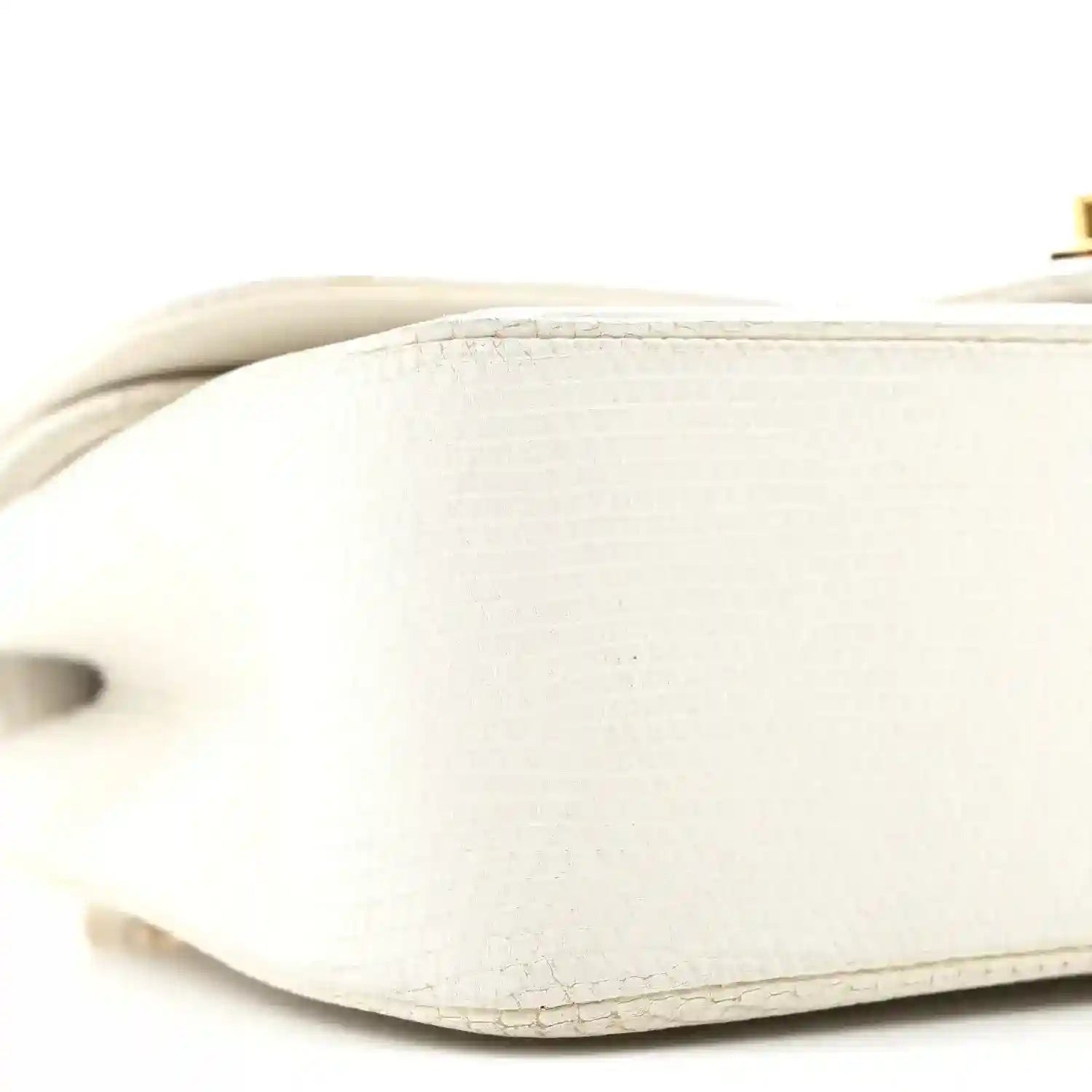 White lizard leather underside with cutout opening and stitched seam
